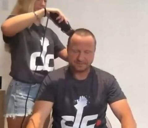 Lexi Brooks shaving her father Scott Brooks hair after the donation was raised.